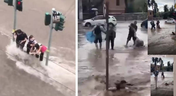 ΑΘΗΝΑ ΚΑΚΟΚΑΙΡΙΑ-ΑΔΙΑΝΟΗΤΟ: Πολίτες πιάνονται από σηματοδότες για να μη τους παρασύρουν οι χείμαρροι (Video)